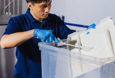 Technician performing hygiene checks on kitchen equipment